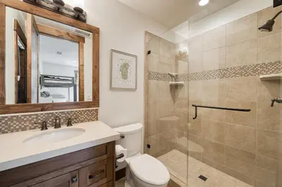 a bathroom with a shower and a toilet and a sink at Rising Sun Retreat at Schaffer's Mill by Tahoe Getaways - Luxury Pet Friendly w Air Conditioning in Truckee