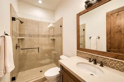 a bathroom with a shower and a sink and a toilet at Rising Sun Retreat at Schaffer's Mill by Tahoe Getaways - Luxury Pet Friendly w Air Conditioning in Truckee