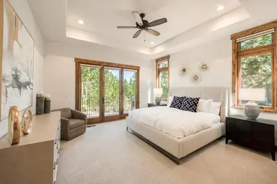 a bedroom with a bed and a couch at Rising Sun Retreat at Schaffer's Mill by Tahoe Getaways - Luxury Pet Friendly w Air Conditioning in Truckee