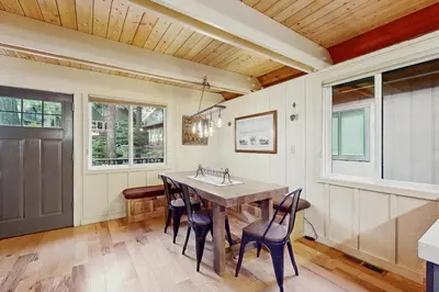 a kitchen with a table and chairs and a sink at Camp Tahoe in Incline Village