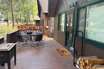 a patio with a table and chairs on a house at Camp Tahoe in Incline Village