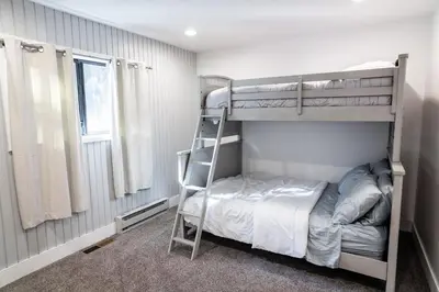 a bedroom with two bunk beds and a ladder at Mammoth Lakes Ski Getaway in Mammoth Lakes