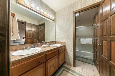 a bathroom with two sinks and a shower at Townhouse wLake View #254 at Donner Lake Village in Truckee