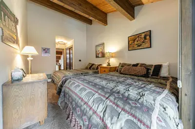a bedroom with two beds in a room at Townhouse wLake View #254 at Donner Lake Village in Truckee