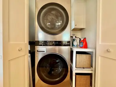 a washer and dryer in a small kitchen at Unique Container, Home 20 Acres, Modern Stay in Placerville