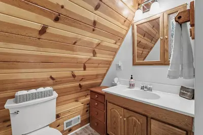 a bathroom with a toilet and a sink at Dogwood Star Star Location Cozy Vibes in Shaver Lake