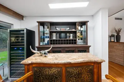 a kitchen with a counter with antlers on top of it at Ranch Stay-A 240 acre Working Ranch in Granite Bay