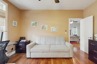 a living room with a couch and a table at Games, Covered Deck Family Home 28 Mi to Yosemite in Groveland