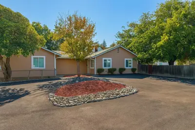 a house with a tree in the middle of a driveway at 2 bed 1 bath special woodlake B in Sacramento