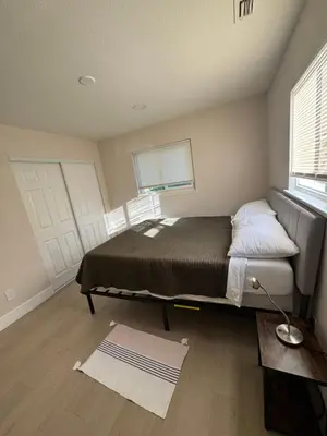 a bedroom with a bed and a window at 2 bed 1 bath special woodlake duplex A in Sacramento