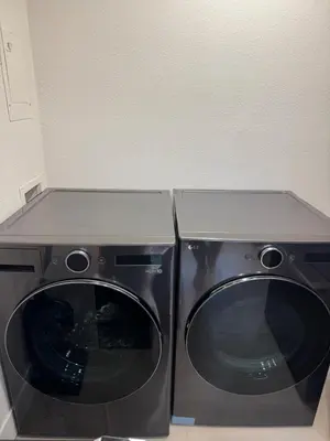 a dryer and a washing machine in a room at 2 bed 1 bath special woodlake duplex A in Sacramento