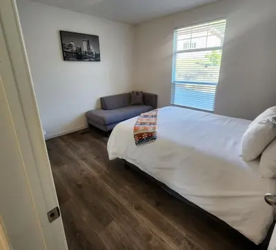 a bedroom with a bed and a couch and a window at Home away from Home - 6 miles from the SNP in Three Rivers