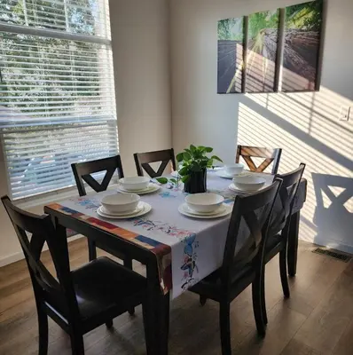 a dining room table with chairs and a tablecloth on it at Home away from Home - 6 miles from the SNP in Three Rivers