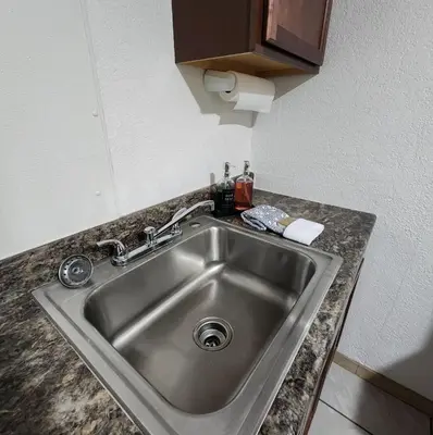 a stainless steel sink in a kitchen counter at The Getaway -6 miles from SNP in Three Rivers