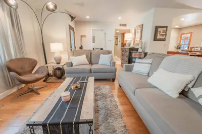 a living room with a couch and a table at Gateway To Sequoia River House in Three Rivers