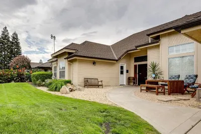 a house with a backyard with a patio at Golf, Hike, Explore Apt 9 Mi to Dtwn Fresno! in Fresno