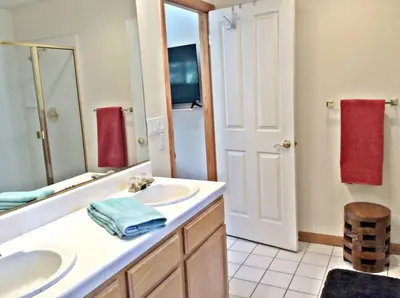 a bathroom with two sinks and a large mirror at Large 3 Bedrooms Outdoor Seating in Tahoe Vista