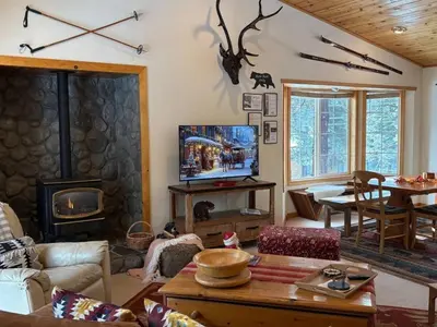 a living room with a couch and a tv and a fireplace at Large 3 Bedrooms Outdoor Seating in Tahoe Vista