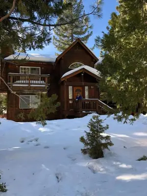 a log cabin with snow on the ground at Large 3 Bedrooms Outdoor Seating in Tahoe Vista