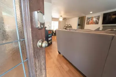 a door leading into a living room with a couch at Riverside Retreat in Three Rivers - Natures Paradise in Three Rivers
