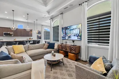 a living room with a couch and a table at The Executive Retreat at Westberry in Madera