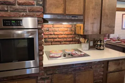 a kitchen with two pizzas on a stove at Pine Ridge Retreat in Stateline