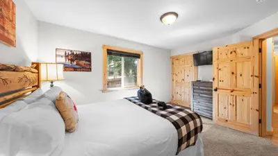 a bedroom with a large bed and a window at Outdoor Dining Backyard Trails Nearby Cedar Hollow Retreat by AvantStay in Tahoma