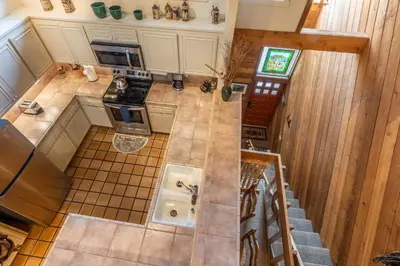 an overhead view of a kitchen with a staircase at 3 Bedrooms + Loft townhome in Snowcreek Phase 3, Private Pool Table Sleeps 6 Guests, Dog Friendly in Mammoth Lakes