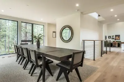 a dining room with a large wooden table and chairs at New Luxury Free Standing 4BR 4 and a halfBA Home Obsidian Reserve #146 Priv Hot Tub, 2-Car Garage Great Views in Mammoth Lakes