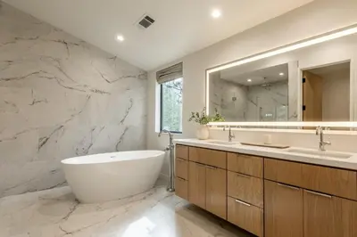a bathroom with a tub and a sink and a mirror at New Luxury Free Standing 4BR 4 and a halfBA Home Obsidian Reserve #146 Priv Hot Tub, 2-Car Garage Great Views in Mammoth Lakes