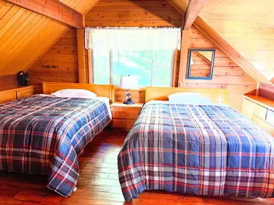 a bedroom with two beds in a cabin at Rustic and Scenic in Cold Springs