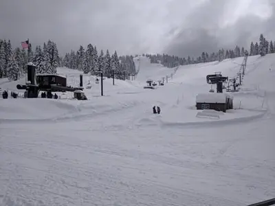 a snow covered ski slope with a ski lift at Rustic and Scenic in Cold Springs
