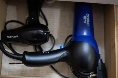 a close up of a hair dryer on a shelf at Sleeps 2 Private Entrance, Spa Tub, Near Casino in Tuolumne