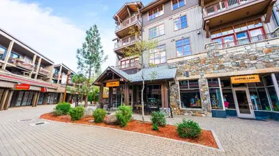 a street in a town with a building at Cozy Northstar Village Escape w Forest Views Easy Lift Access Alpineglow Vista by AvantStay in Truckee