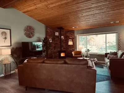 a living room with a couch and a tv at Magic Sequoia Spacious Home in Three Rivers