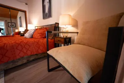 a bedroom with a bed and a table with a lamp at Magic Sequoia Spacious Home in Three Rivers