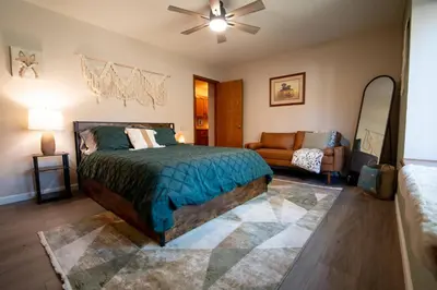 a bedroom with a bed and a couch at Magic Sequoia Spacious Home in Three Rivers