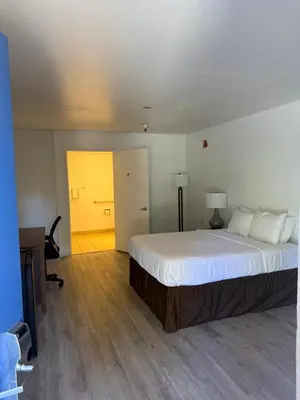 a bedroom with a large bed in a room at Rancho Cordova Inn in Rancho Cordova