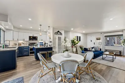 a kitchen and living room with a table and chairs at CYH0883- Patricia's Mountain Paradise home in South Lake Tahoe