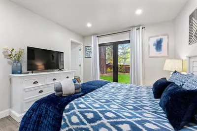a bedroom with a bed with a tv on a dresser at CYH0883- Patricia's Mountain Paradise home in South Lake Tahoe