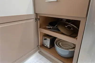 a cabinet with a toilet and a toaster in a kitchen at Charming Tahoe Cabin in Incline Village
