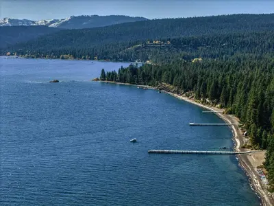 an aerial view of a large lake with trees at Peaceful Forest Retreat Near Lake and Town in Tahoe City
