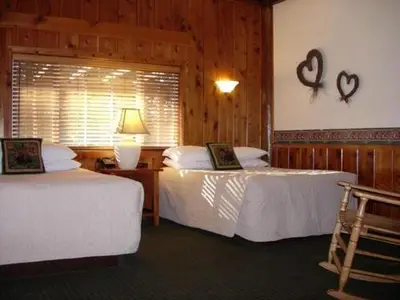 a hotel room with two beds and a window at Timberline Lodge - Arnold - Bear Valley - Murphys in Arnold