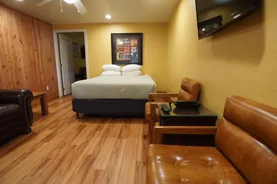a hotel room with a bed and a couch at Timberline Lodge - Arnold - Bear Valley - Murphys in Arnold