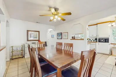 a kitchen and dining room with a wooden table and chairs at Golden Pine Lodge in South Lake Tahoe