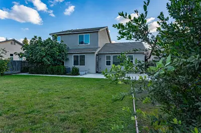 a house with a yard in front of it at Nic's Home in Visalia