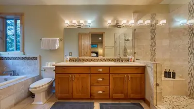 a bathroom with a sink and a toilet and a shower at Cozy Tahoe Retreat w Hot Tub Movie Room Forest Views 10th ave 2 by AvantStay in Tahoma