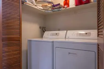 a laundry room with two washing machines on a shelf at Dollar Point for 10-Hot Tub-One Block to the Beach-Filtered Lake Views-Quiet Neighborhood in Tahoe City
