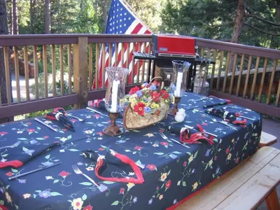 a table with a flag and a table with shoes on it at Dollar Point for 10-Hot Tub-One Block to the Beach-Filtered Lake Views-Quiet Neighborhood in Tahoe City