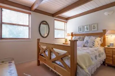 a bedroom with a bed and a mirror at Dollar Point for 10-Hot Tub-One Block to the Beach-Filtered Lake Views-Quiet Neighborhood in Tahoe City